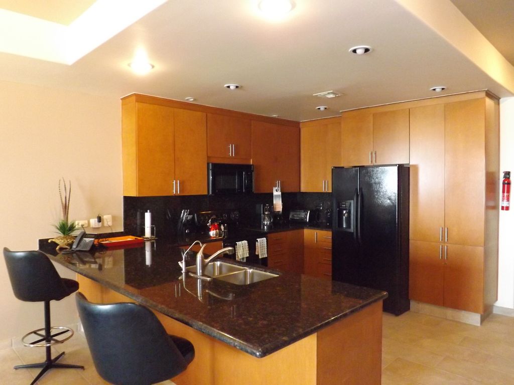 Generous kitchen countertops and a bar eating area