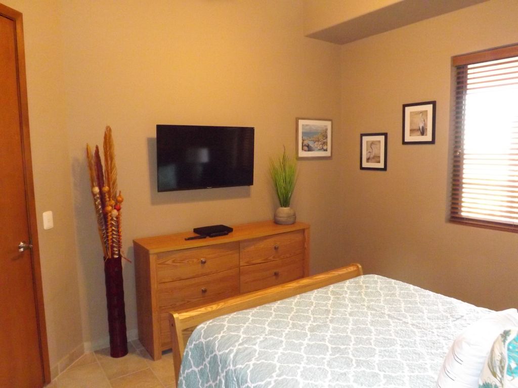 Spacious bedrooms with televisions