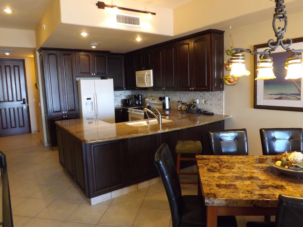 Gorgeous granite countertops adorn this full-size kitchen