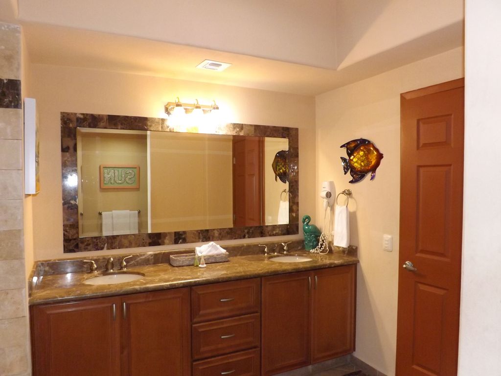 High-end dual vanities in this spacious bathroom