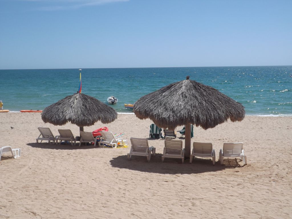 Relax under a Palapa and let your worries wash away