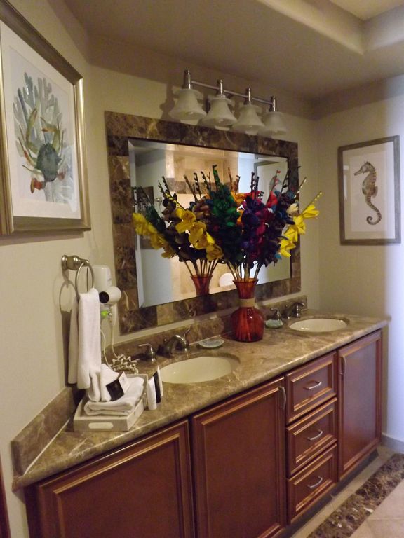 This alluring bathroom has dual vanities