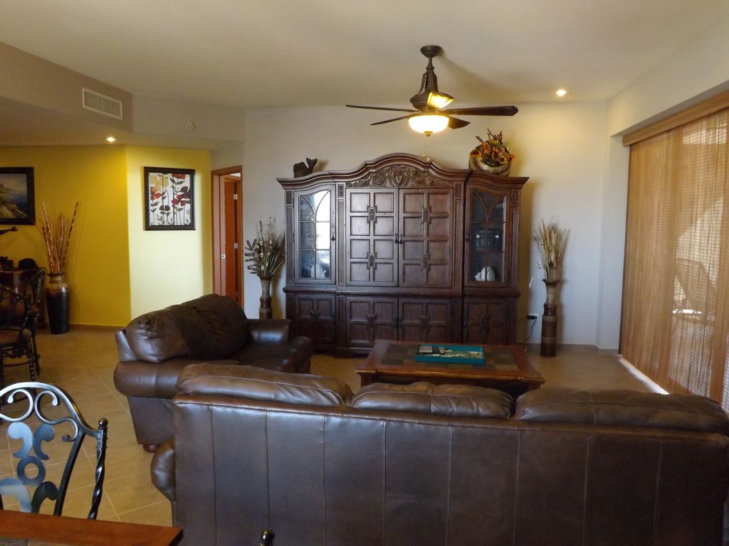 A beautiful entertainment center adorns the living room